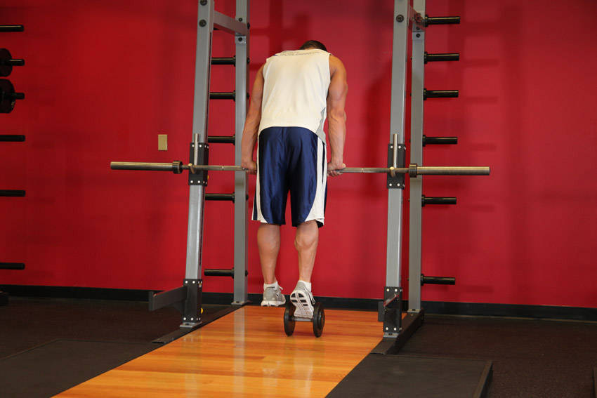 Calf Raise On A Dumbbell — end position