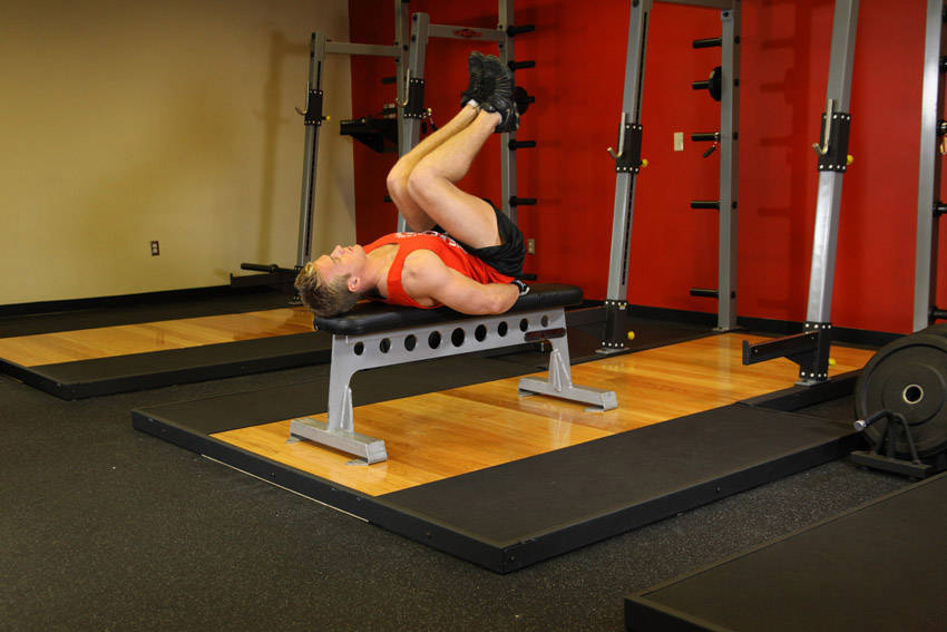 Flat Bench Leg Pull-In — start position