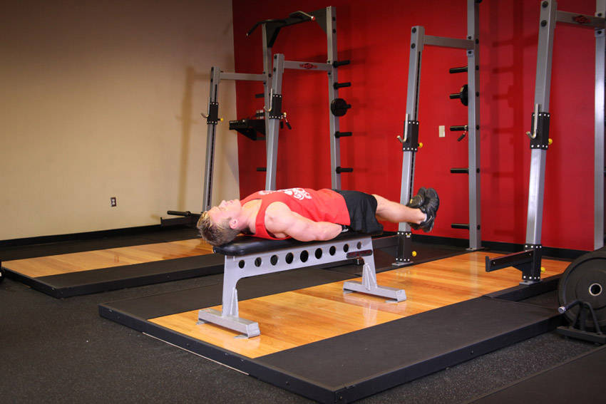 Flat Bench Lying Leg Raise — start position