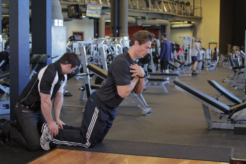 Floor Glute-Ham Raise — end position