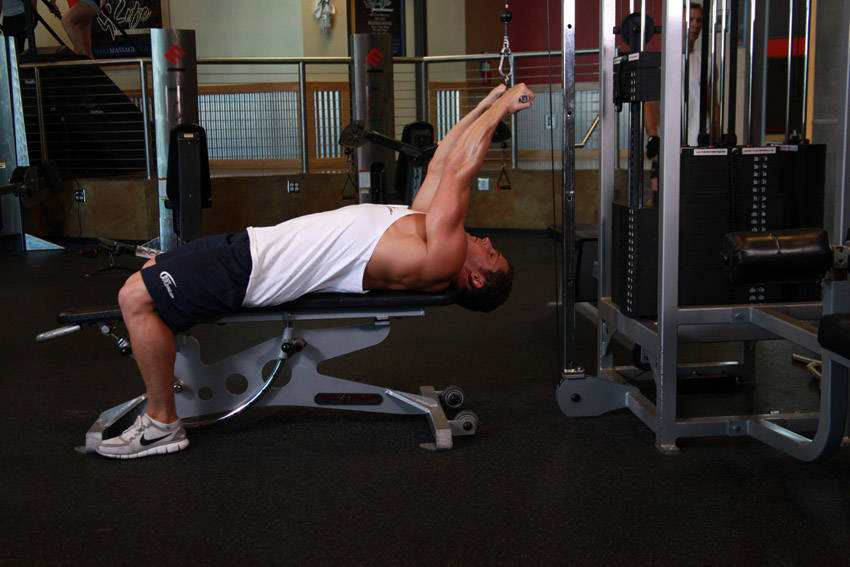 Lying Close-Grip Bar Curl On High Pulley — start position