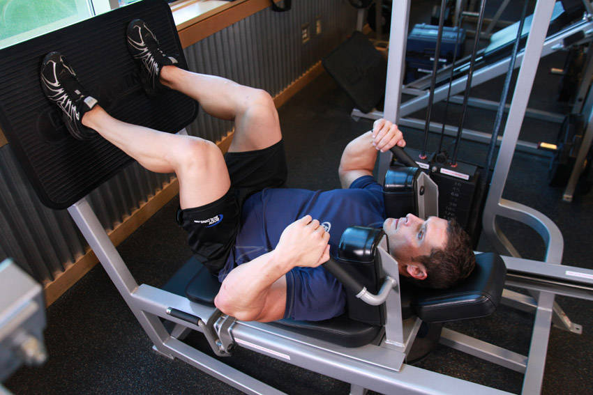 Lying Machine Squat — start position