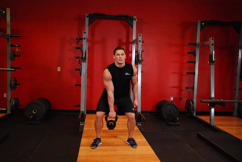 One-Arm Kettlebell Clean and Jerk — start position