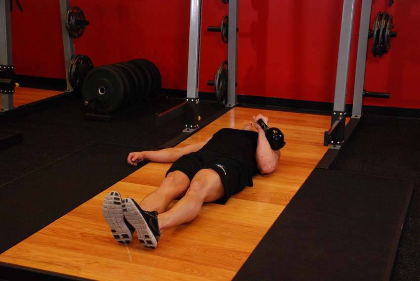 One-Arm Kettlebell Floor Press — start position