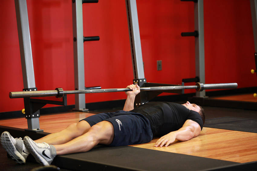 One Arm Floor Press — start position