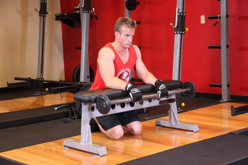 Palms-Down Wrist Curl Over A Bench — start position
