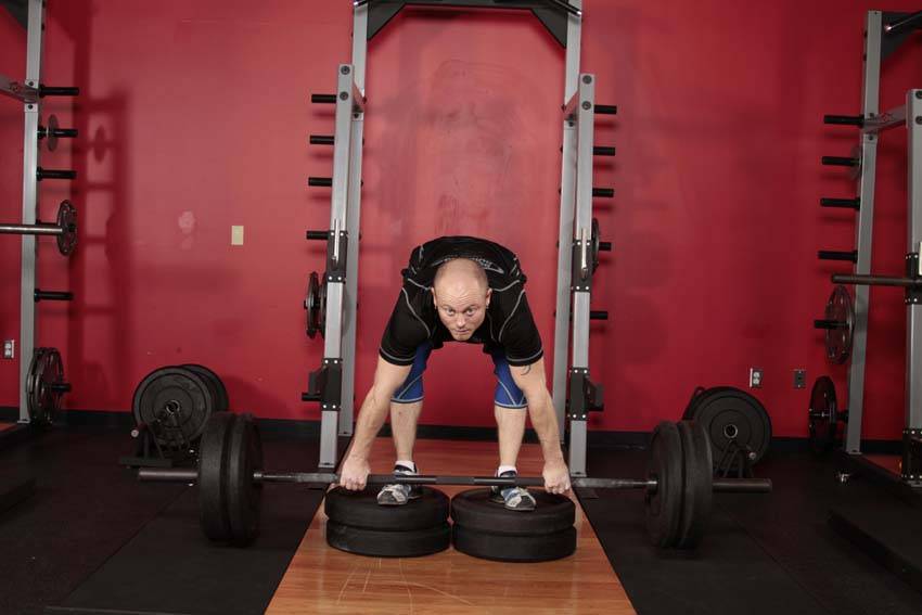 Romanian Deadlift from Deficit — end position