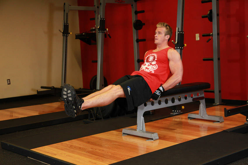 Seated Flat Bench Leg Pull-In — start position
