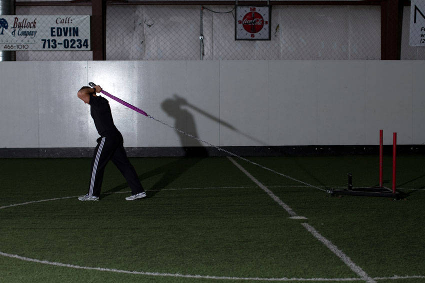 Sled Overhead Triceps Extension — start position