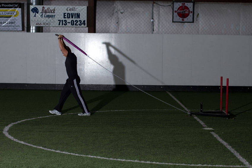 Sled Overhead Triceps Extension — end position