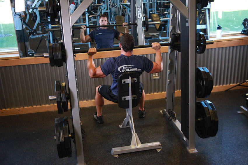 Smith Machine Overhead Shoulder Press — start position