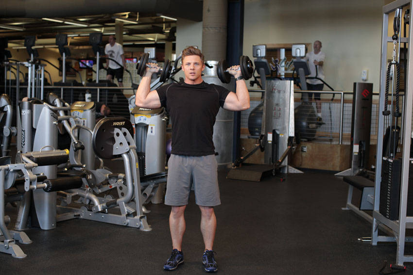 Standing Alternating Dumbbell Press — start position