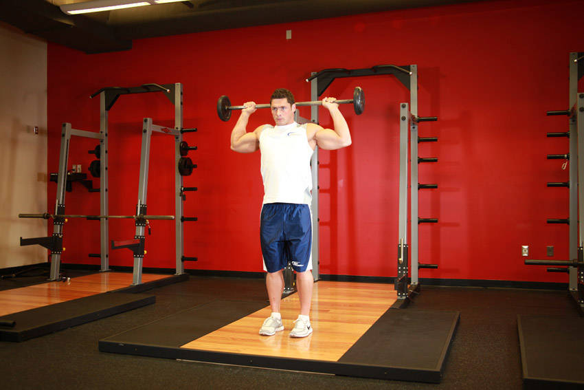 Standing Barbell Press Behind Neck — start position