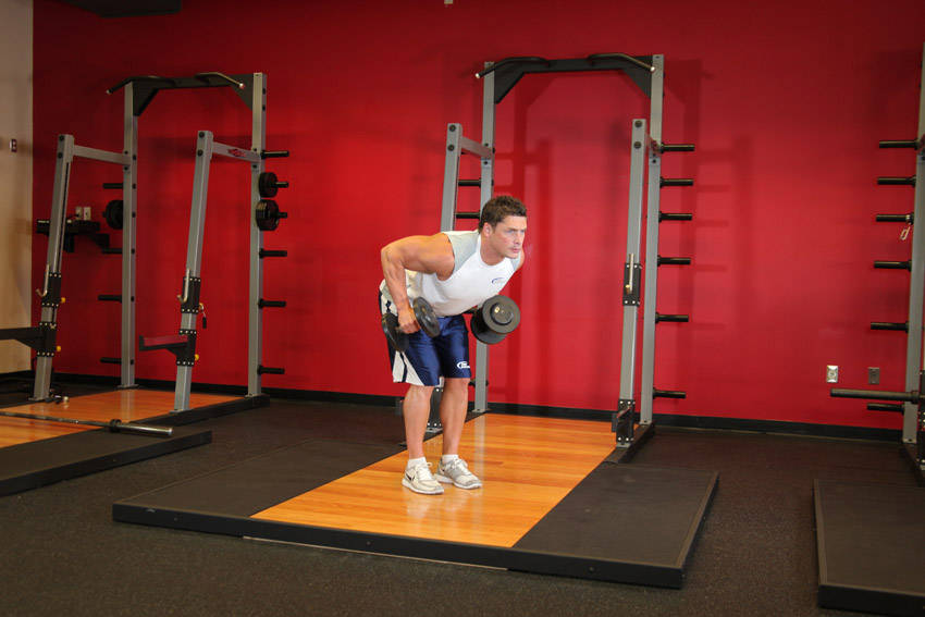 Standing Bent-Over Two-Arm Dumbbell Triceps Extension — start position