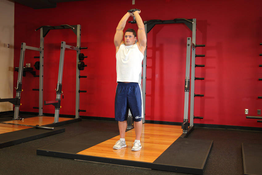 Standing Dumbbell Triceps Extension — start position