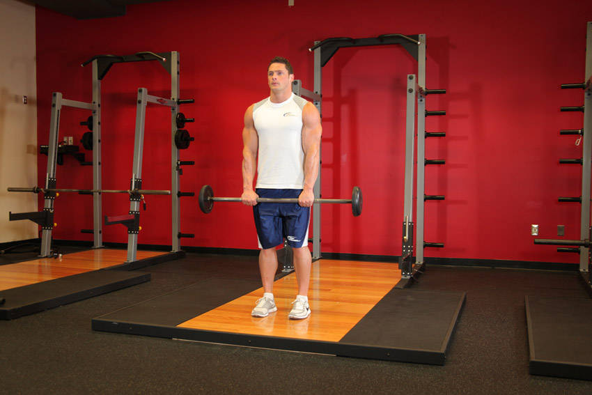 Standing Front Barbell Raise Over Head — start position