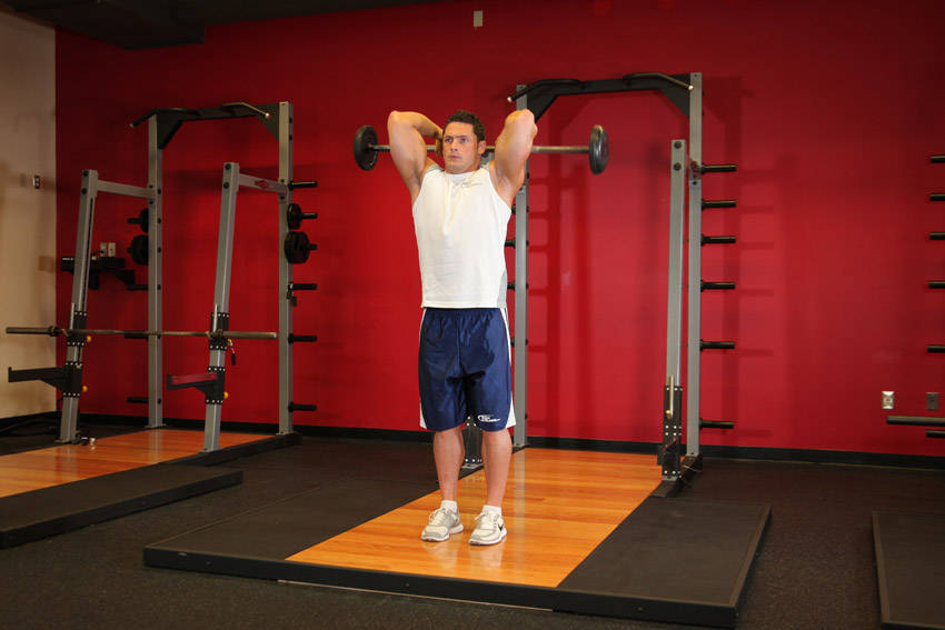 Standing Overhead Barbell Triceps Extension — start position