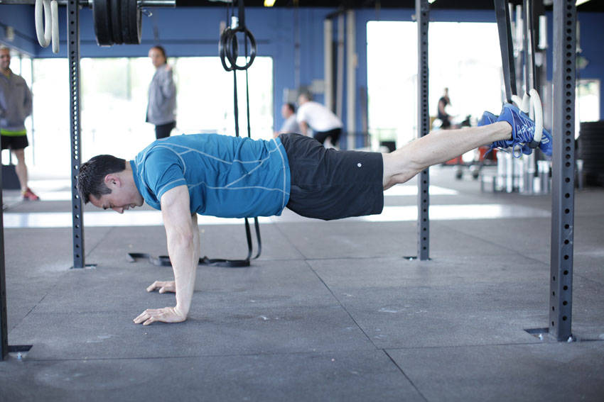 Suspended Reverse Crunch — start position