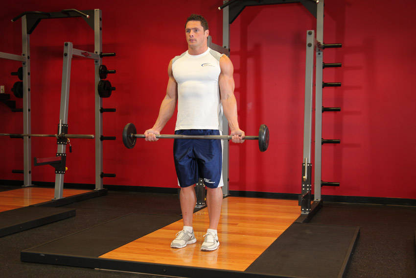 Wide-Grip Standing Barbell Curl — start position